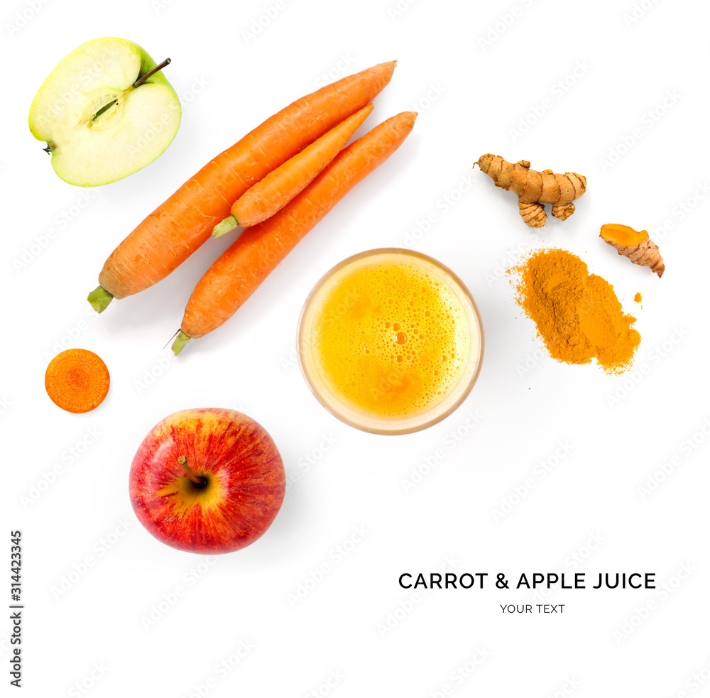 由胡萝卜和苹果汁制成的创意布局。平躺。食物概念。胡萝卜和苹果在whit上