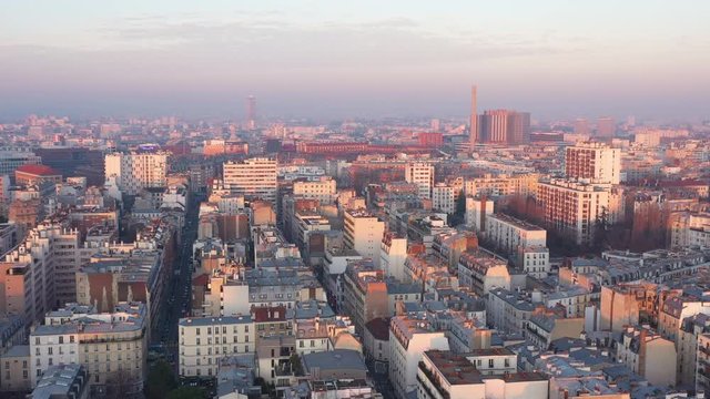 Paris sunset aerial shot Bichat Hospital chimney rooftops view polluted sky France