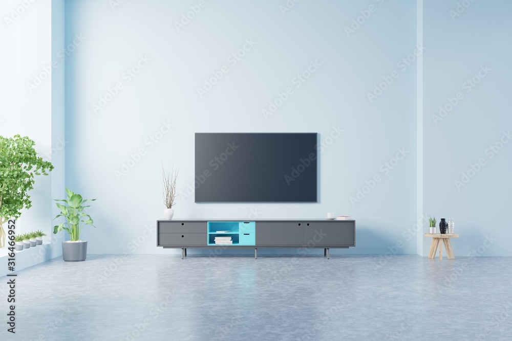 蓝色背景的现代客厅橱柜上的电视。