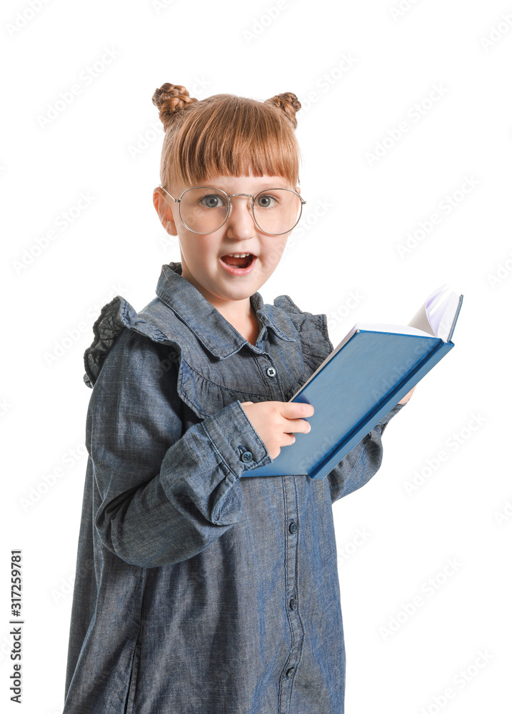 Surprised little girl with book on white background
