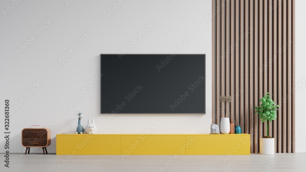 黄色橱柜上的电视或在现代客厅里放置物品，白色橱柜上有灯、桌子、花草