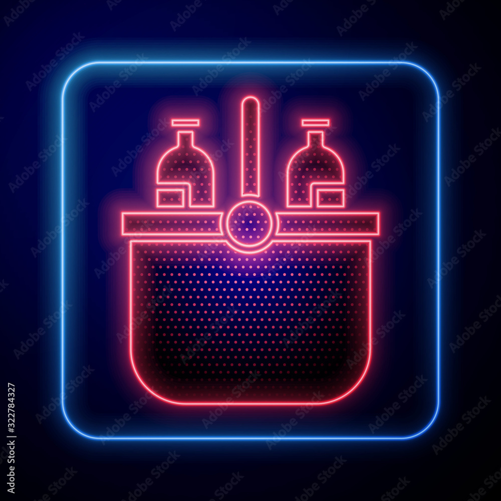 Glowing neon Cooler bag and water icon isolated on blue background. Portable freezer bag. Handheld r