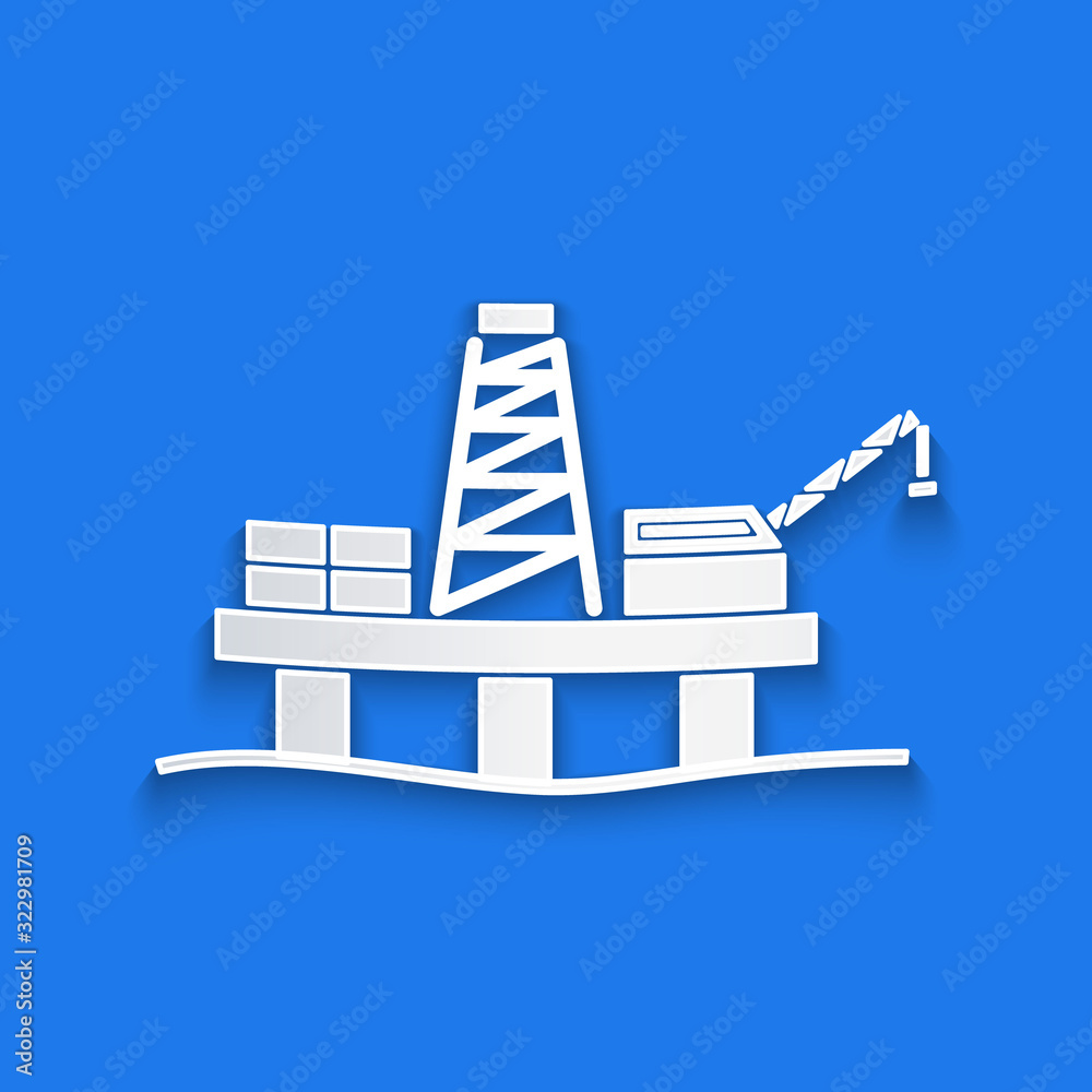 Paper cut Oil platform in the sea icon isolated on blue background. Drilling rig at sea. Oil platfor