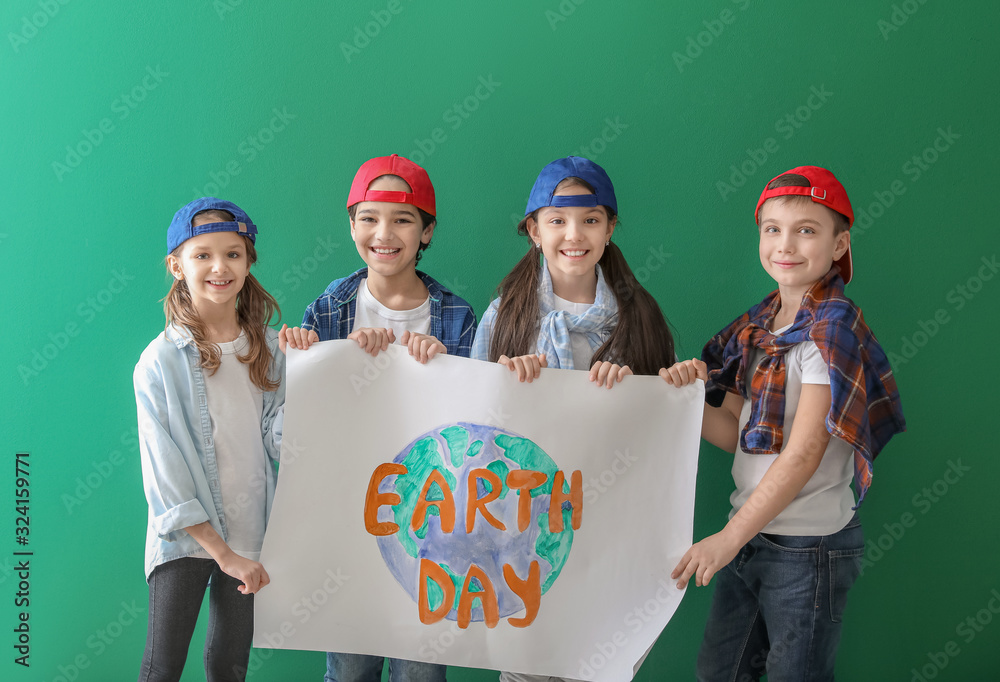 Little children with drawing on color background. Earth Day celebration