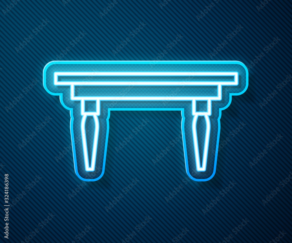 Glowing neon line Wooden table icon isolated on blue background. Vector Illustration