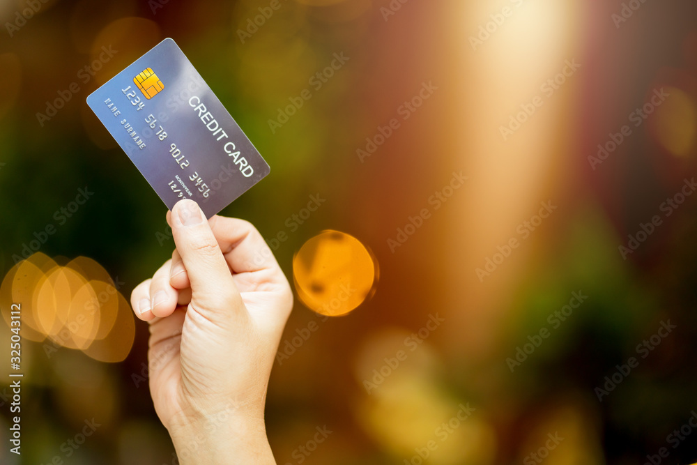 business shopping merchant ideas concept Close up of woman hand holding credit card for shopping wit