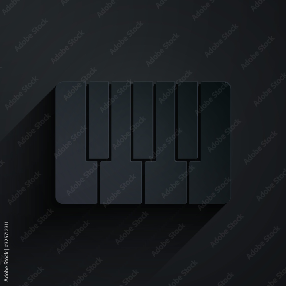 Paper cut Music synthesizer icon isolated on black background. Electronic piano. Paper art style. Ve