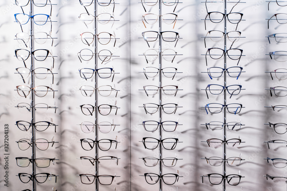Row of luxury eyeglass at an opticians store. Gglasses background