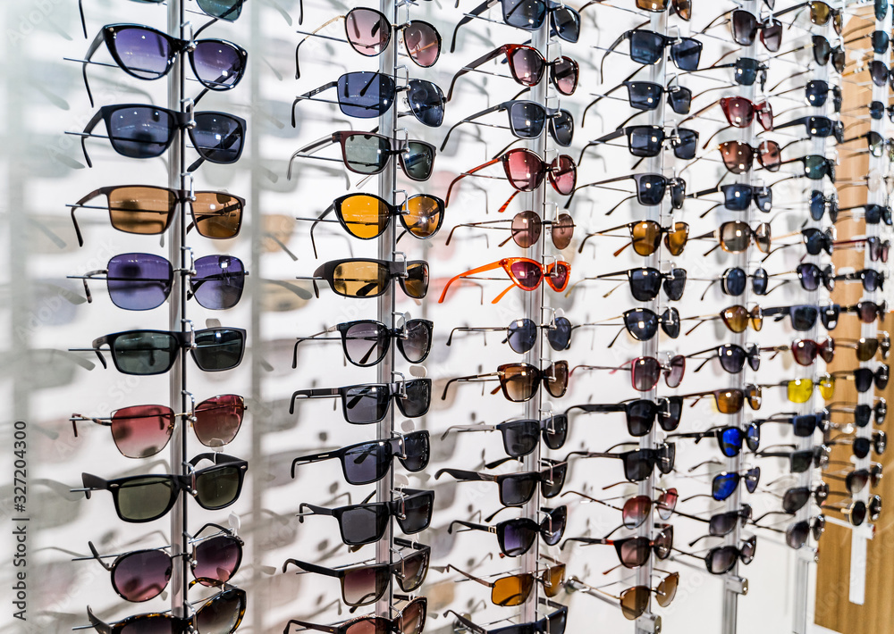 Sales rack of sunglasses. A colorful display of sunglasses for sale