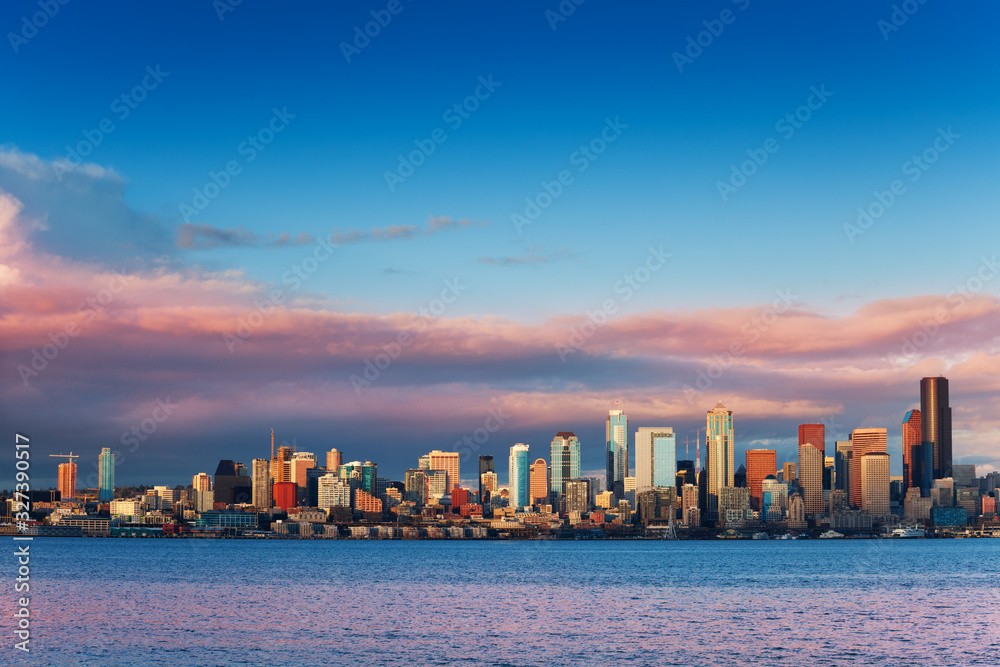 Seattle waterfront downtown buildings wide skyline view at evening sunset on spring day, Washington,