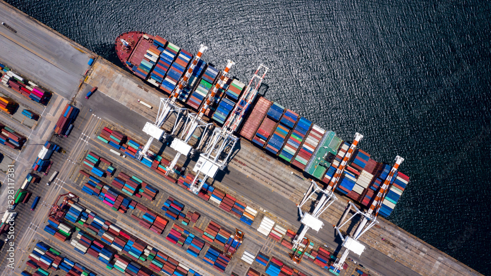 Container ship loading and unloading in deep sea port, Aerial view of business logistic import and e