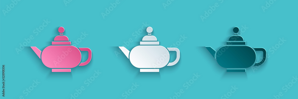 Paper cut Traditional Chinese tea ceremony icon isolated on blue background. Teapot with cup. Paper 