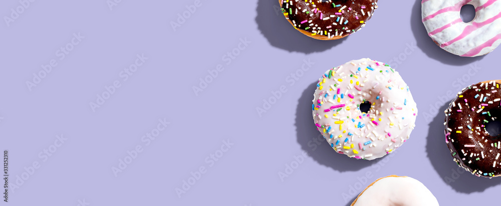 Collection of delicious donuts overhead view flat lay