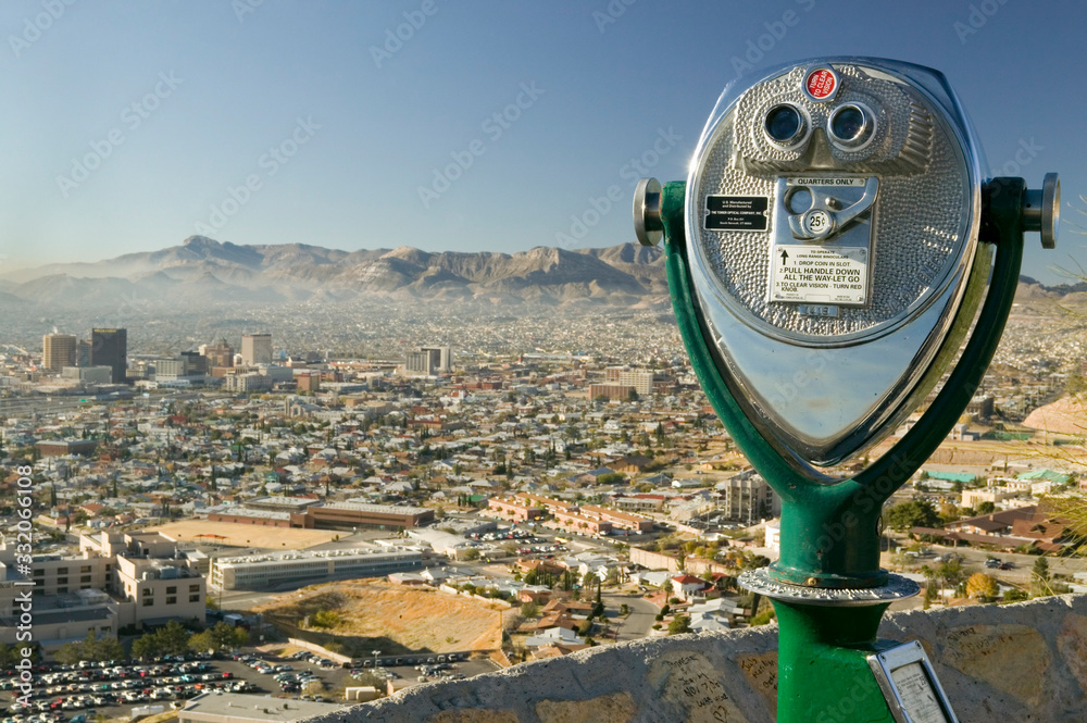 Long range binoculars for tourists and panoramic view of skyline and downtown of El Paso Texas looki