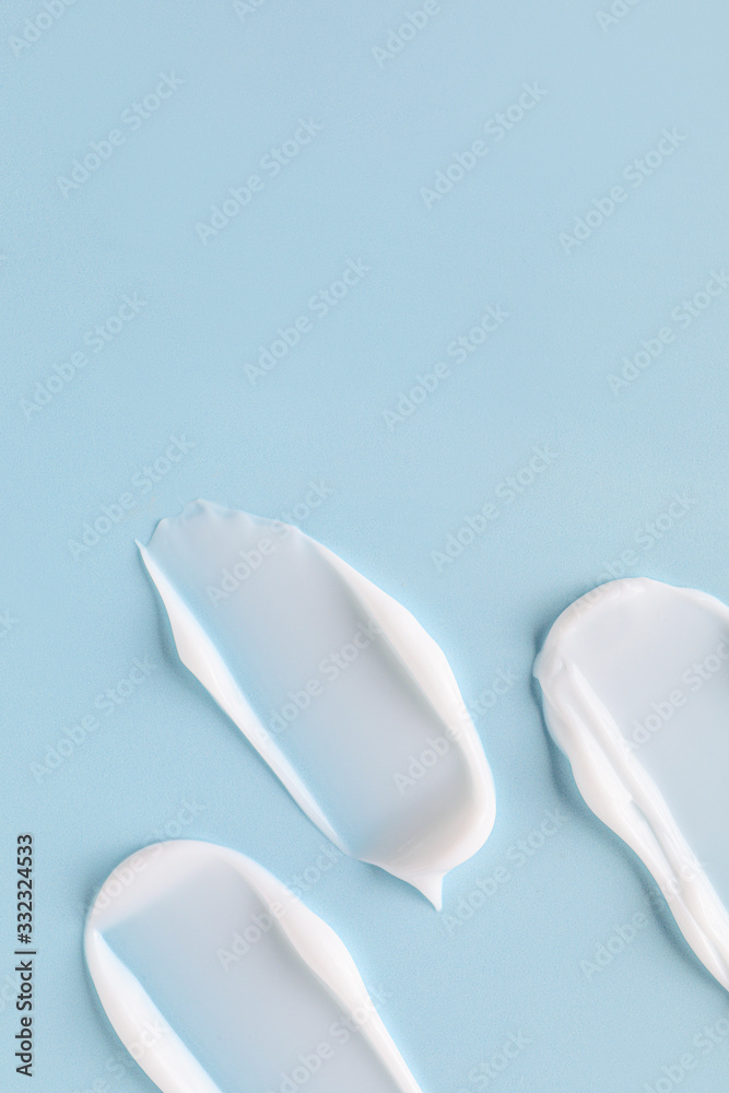 Samples of cream on color background