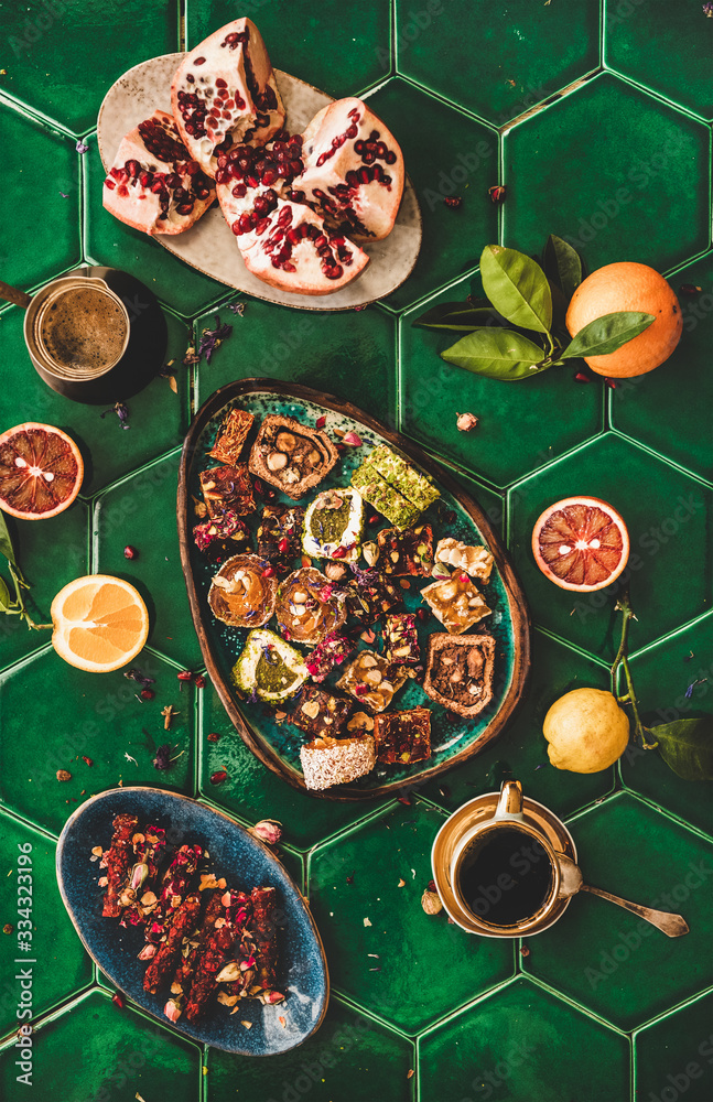 Flat-lay of variety of Turkish traditional lokum sweet delight with Turkish coffee and fresh fruits 