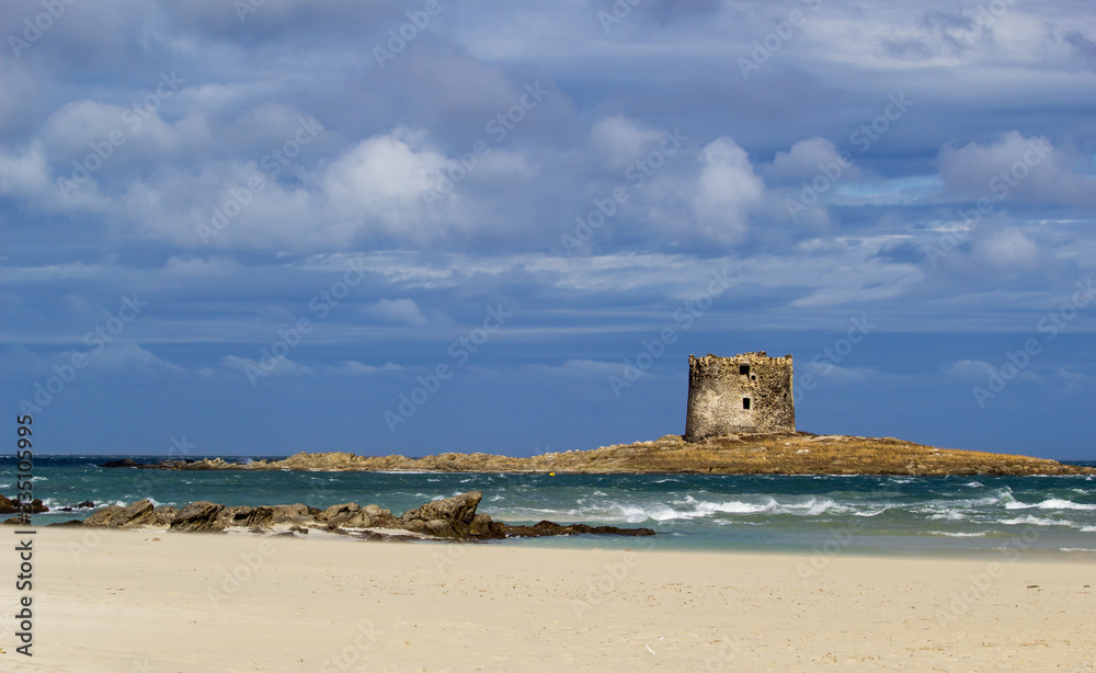 Stunning  view on the old aragonese tower in La Pelosa Beach. beautifull beach with white sands, wav