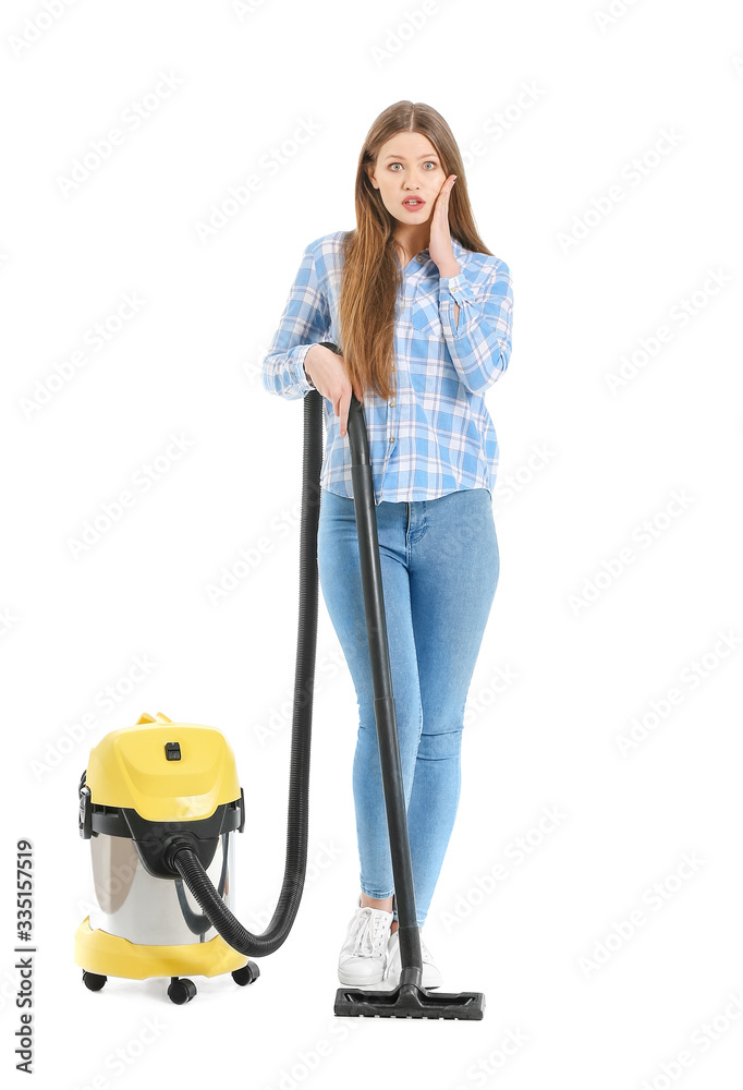 Shocked woman with vacuum cleaner on white background