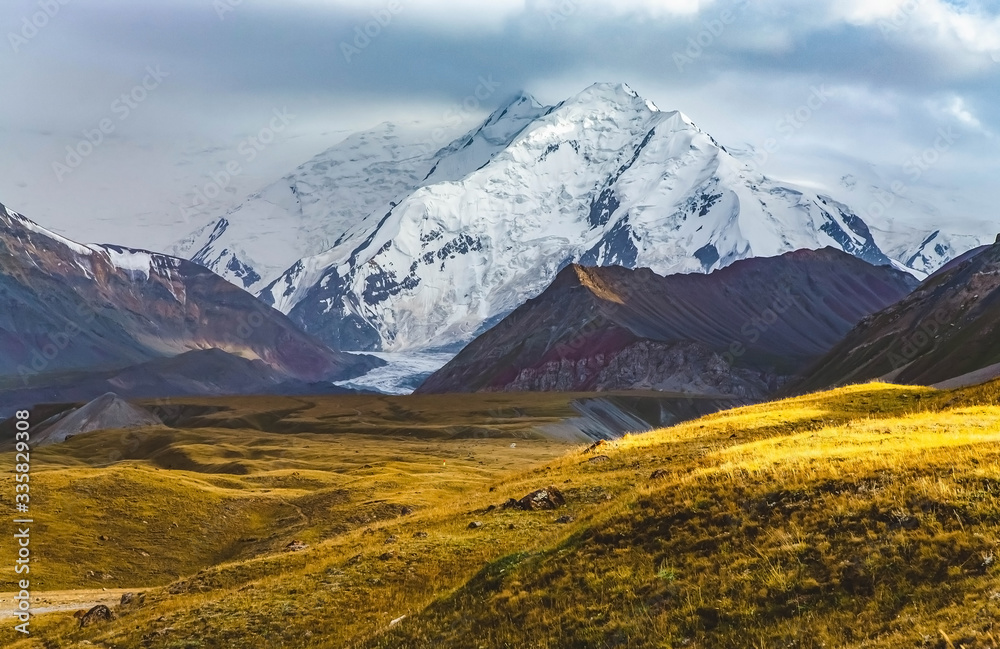Scenic summer landscape of snowy mountain in Kyrgyzstan. The Trans-Alay Range. Pamir Mountain System