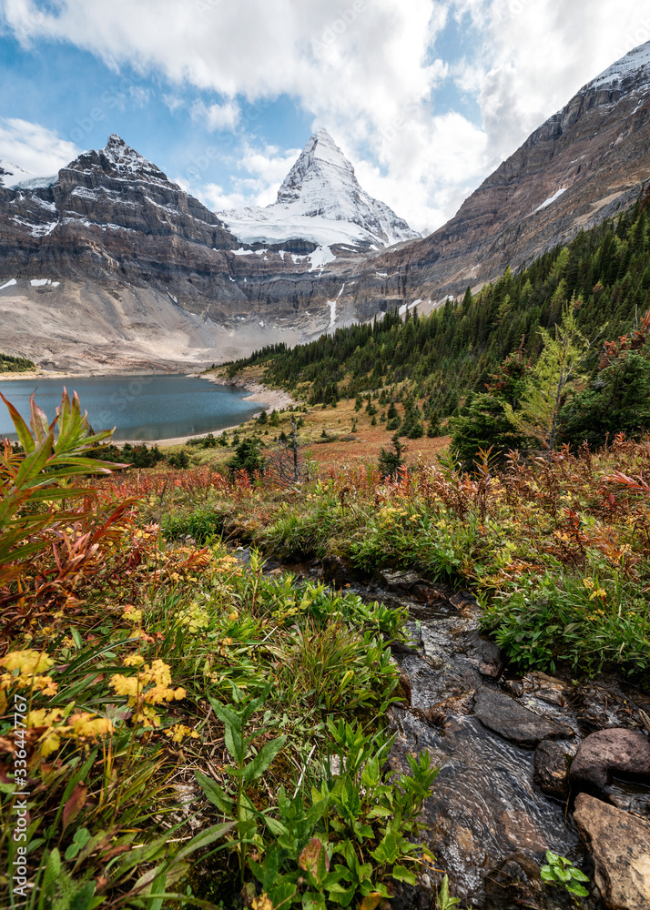 Mount Assiniboine with Lake Magog in autumn wilderness at provincial park