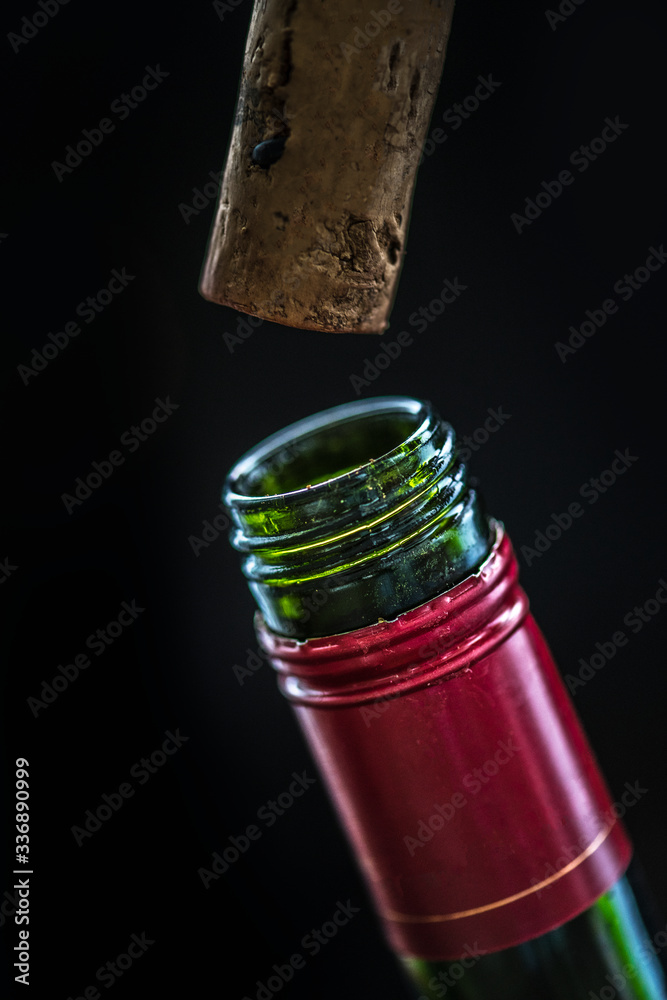 Uncorking a bottle of red wine
