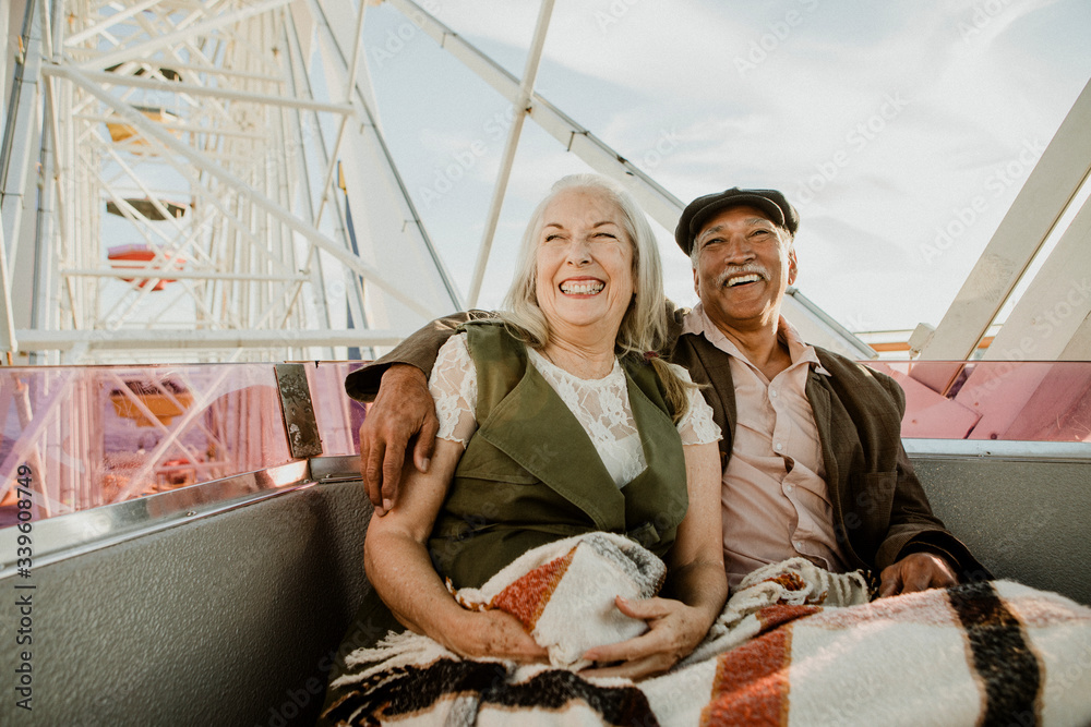 Happy senior couple on a Ferris wheel
