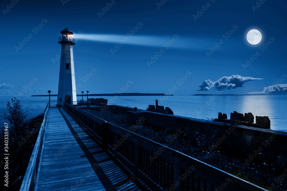 This is a beautiful photo illustration of a dramatic night time scene of a blue moonrise in a clear 