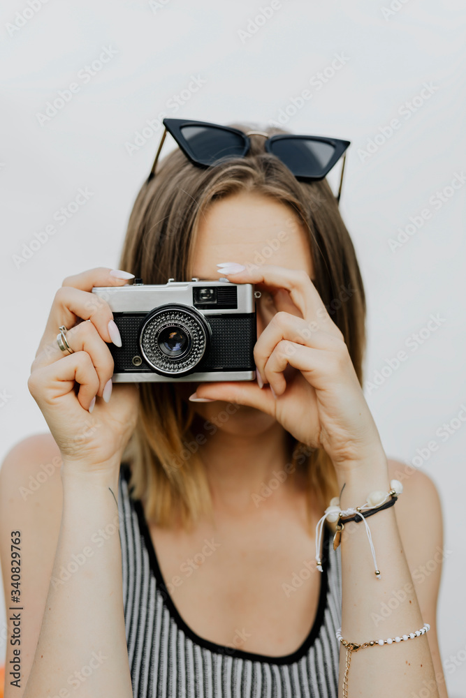 Girl with an analog camera