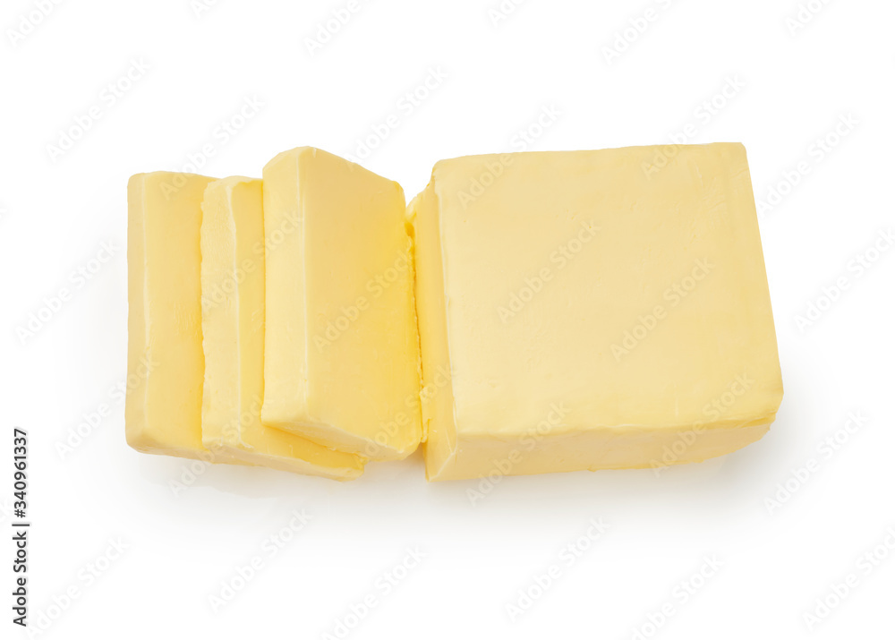 Sliced pieces of butter isolated on white background. Top view of butter slices