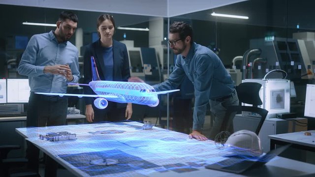 Aeronautics Factory Office Meeting Room: Team of Diverse Engineers and Managers Work on an Augmented Reality Airplane Jet Engine Simulation. Modern Industry 4.0 Research and Development Test.