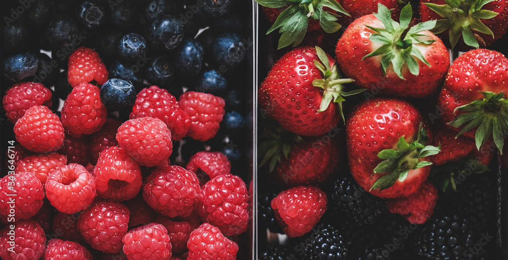 健康的夏季素食午餐。新鲜的时令草莓、覆盆子、蓝莓和bl的平放