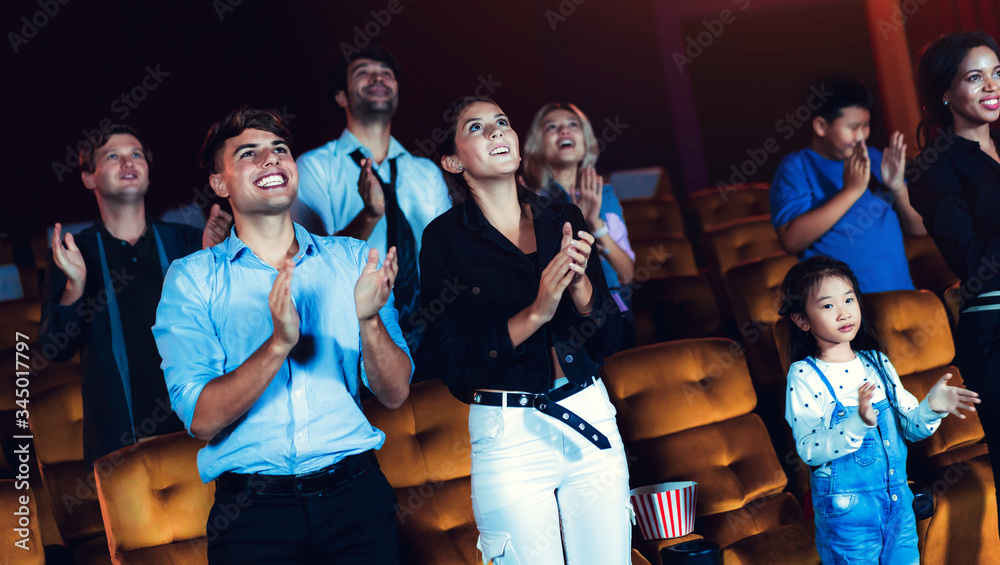 People audience watching movie in the movie theater cinema. Group recreation activity and entertainm