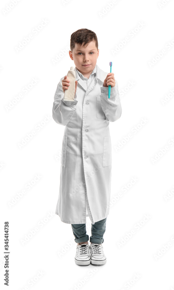 Little dentist with paste and tooth brush on white background