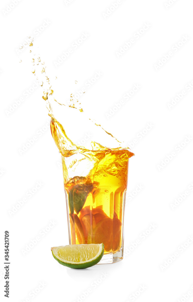 Glass of tasty cold ice tea with splash on white background