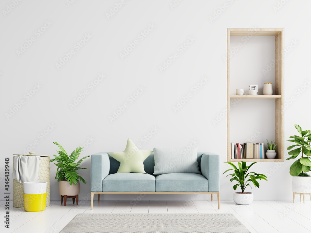 空荡荡的客厅，蓝色沙发、植物和桌子，空荡荡的白墙背景。
