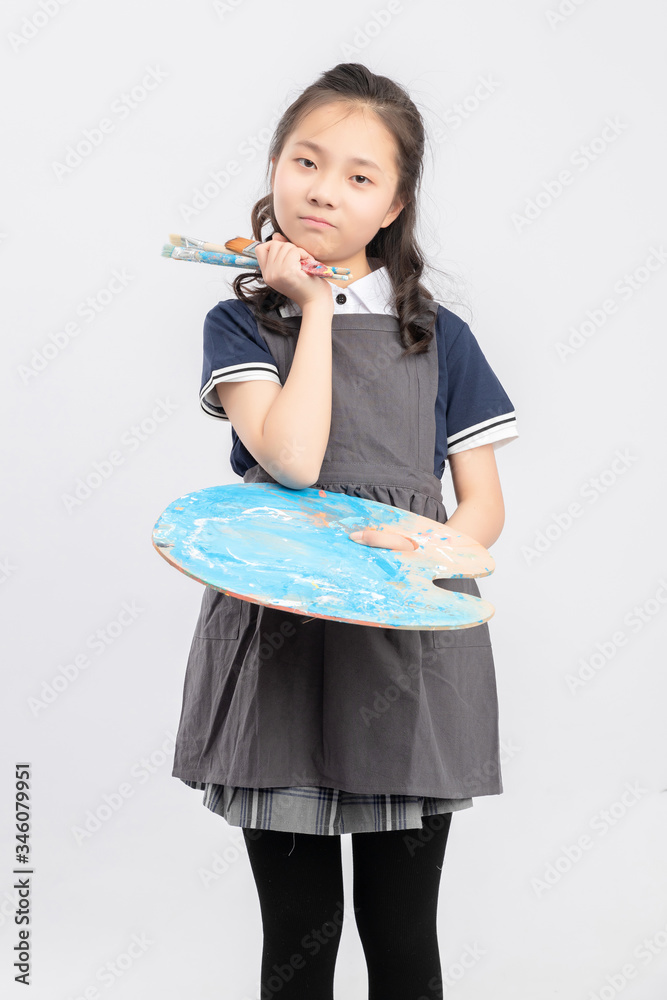 Asian primary school girls who are painting