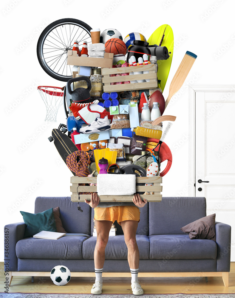 Healthy lifestyle concept, a man holds a box with vegetarian products and sports equipment

