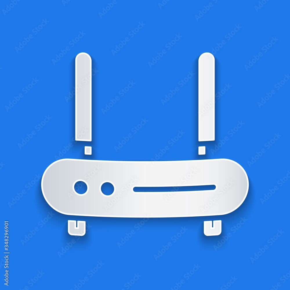 Paper cut Router and wi-fi signal icon isolated on blue background. Wireless ethernet modem router. 