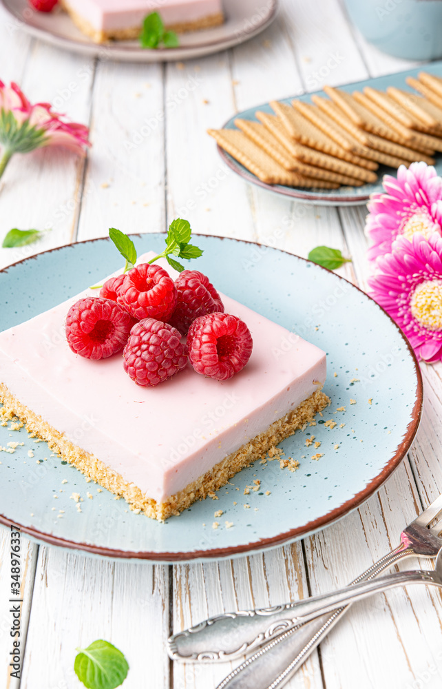 Delicious refreshing dessert, no bake sweet raspberry cheesecake bars topped with fresh berries