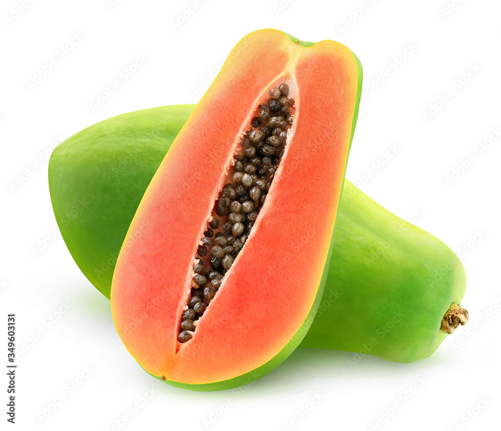 One whole green papaya fruit and a half isolated on white background