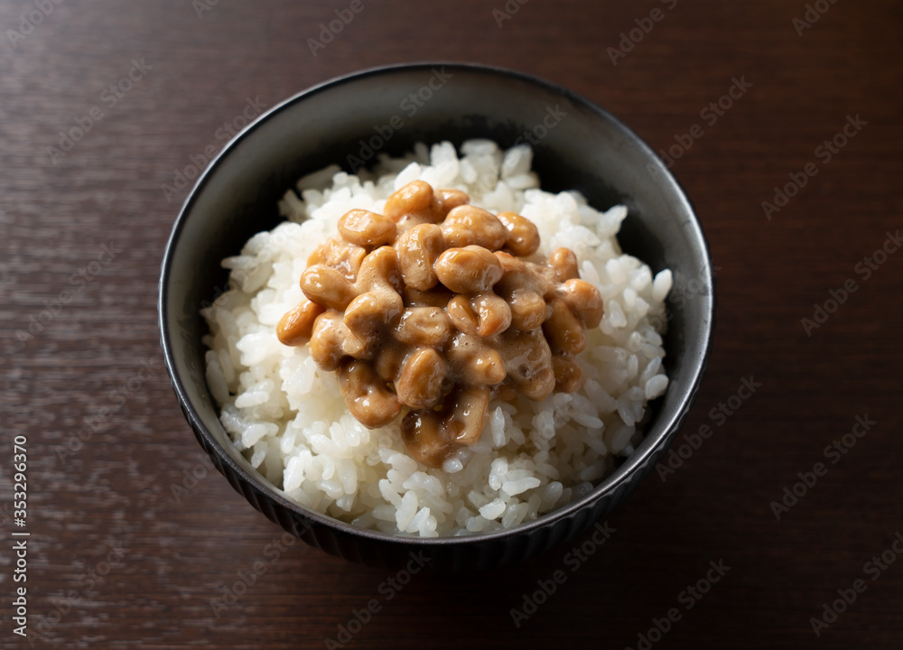 Natto and rice set against a dark wooden background
