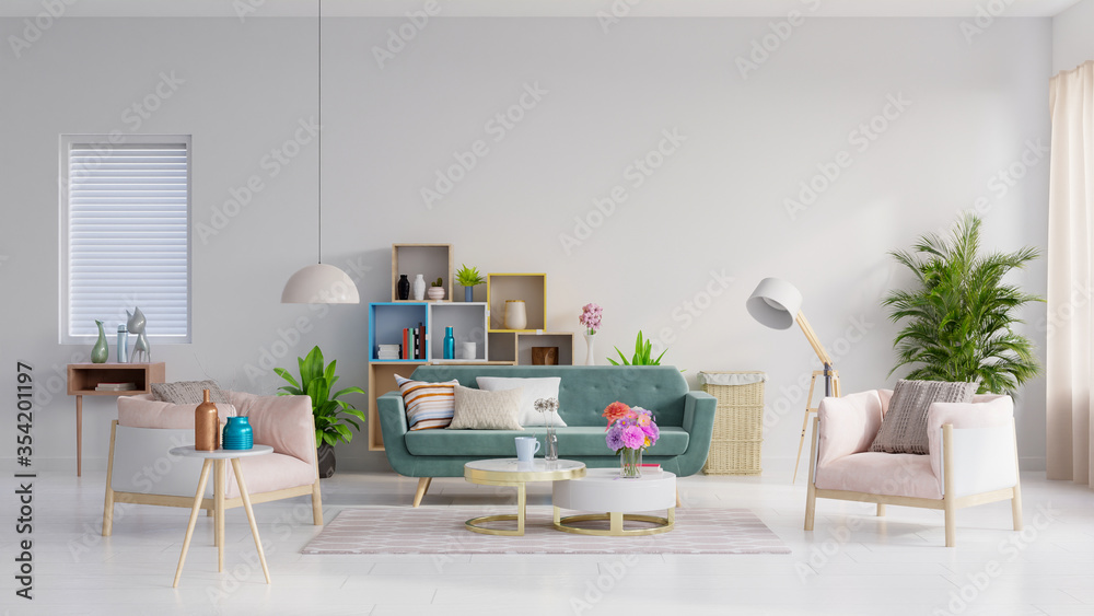 绿色沙发和粉色扶手椅，位于宽敞的客厅内部，靠近木质露台，有植物和架子