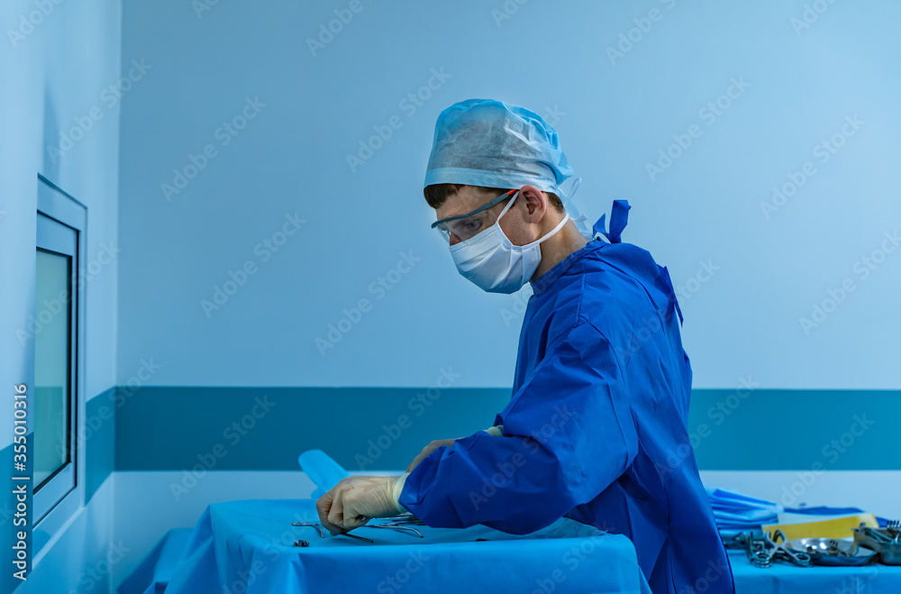 Surgeon at work in operating room. Modern equipment in operating room. Medical devices for neurosurg