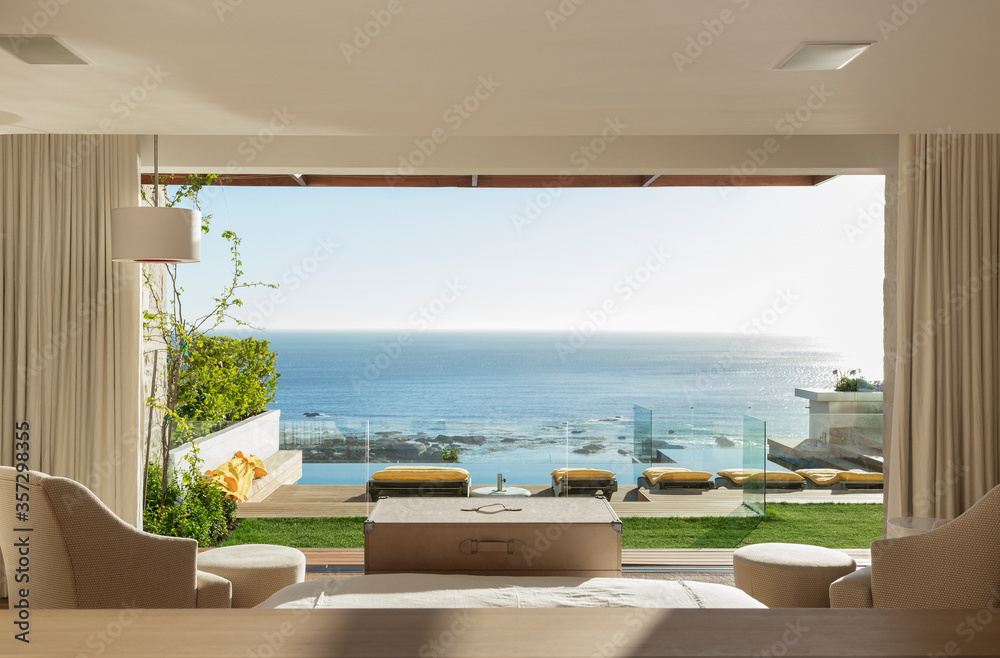 Sunny bedroom and patio overlooking ocean