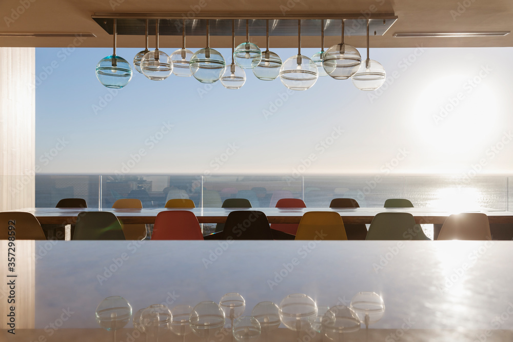 Long dining table overlooking ocean