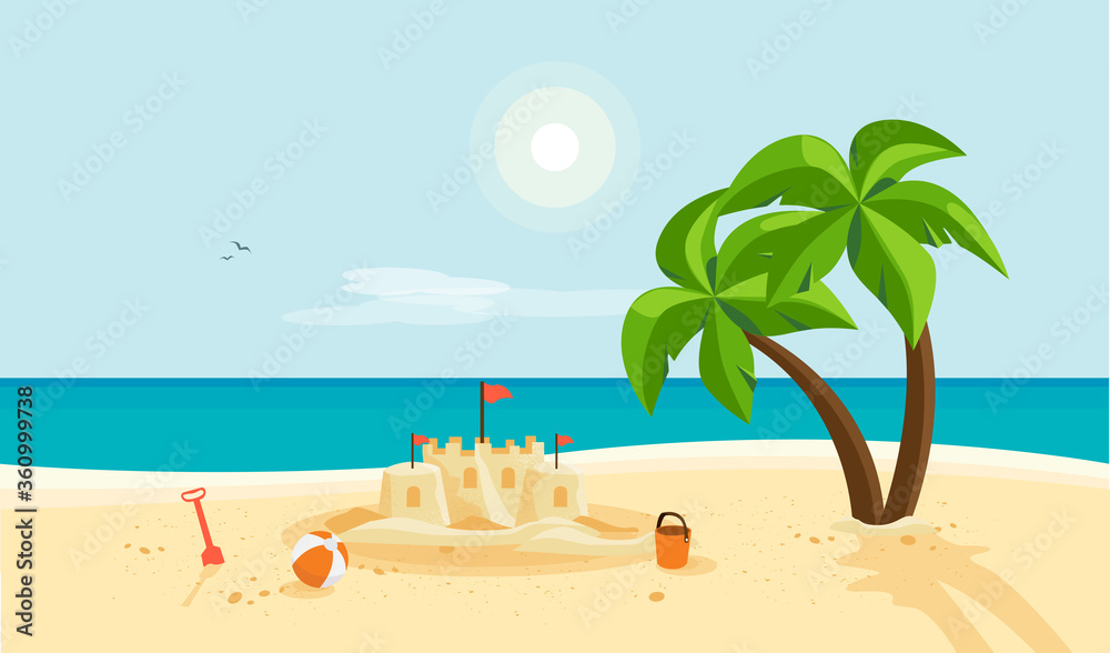 沙滩上孤独的沙城堡，棕榈树和蓝色的海洋海岸线。晴朗的夏天阳光明媚