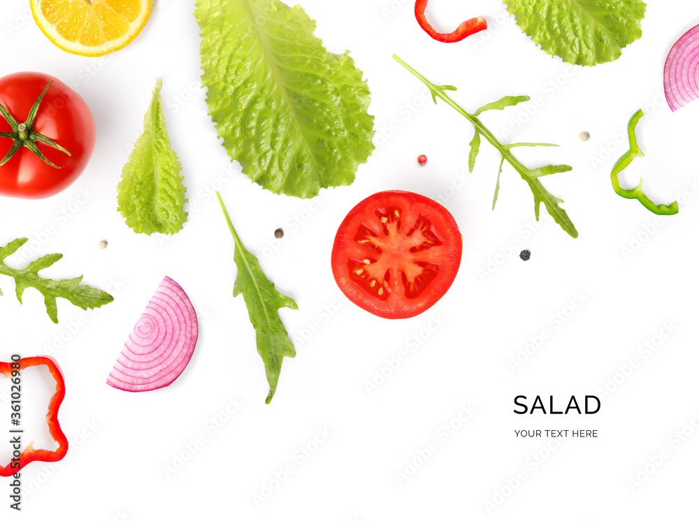 由夏季蔬菜制成的创意布局。食物概念。番茄、洋葱、胡椒、沙拉叶和l
