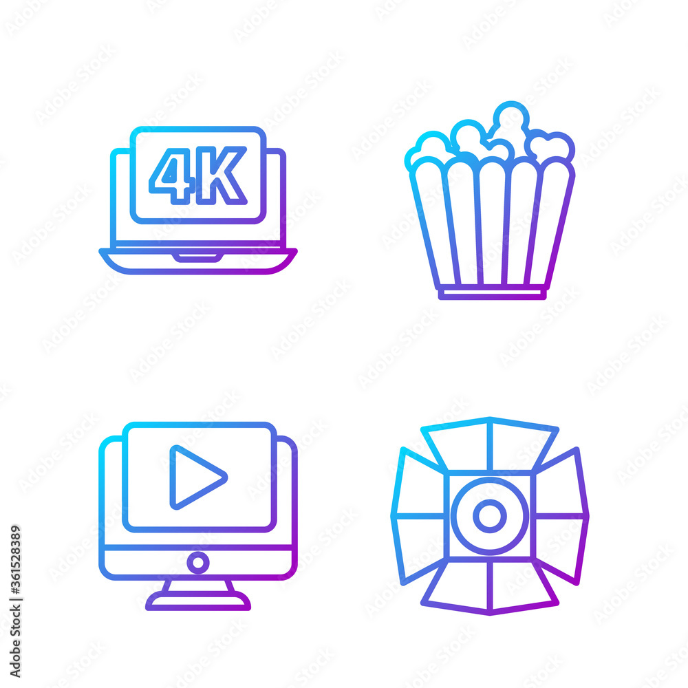 设置线电影聚光灯，在线播放视频，带4k视频的笔记本电脑和盒子里的爆米花。渐变色