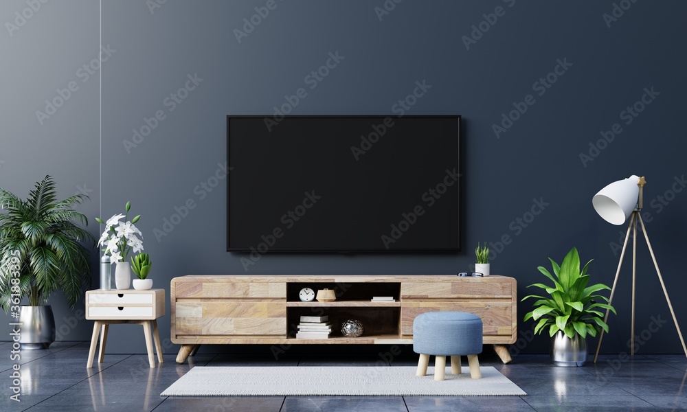 客厅深色墙上的LED电视，简约设计。