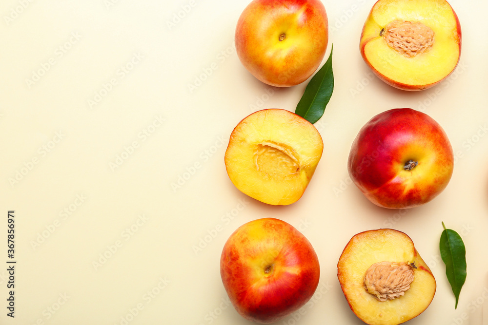 Sweet ripe nectarines on color background